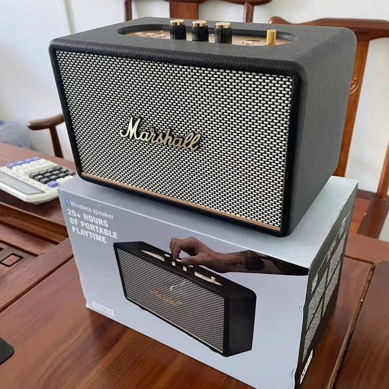 Marshall speaker on top of its packaging box on a wooden table.