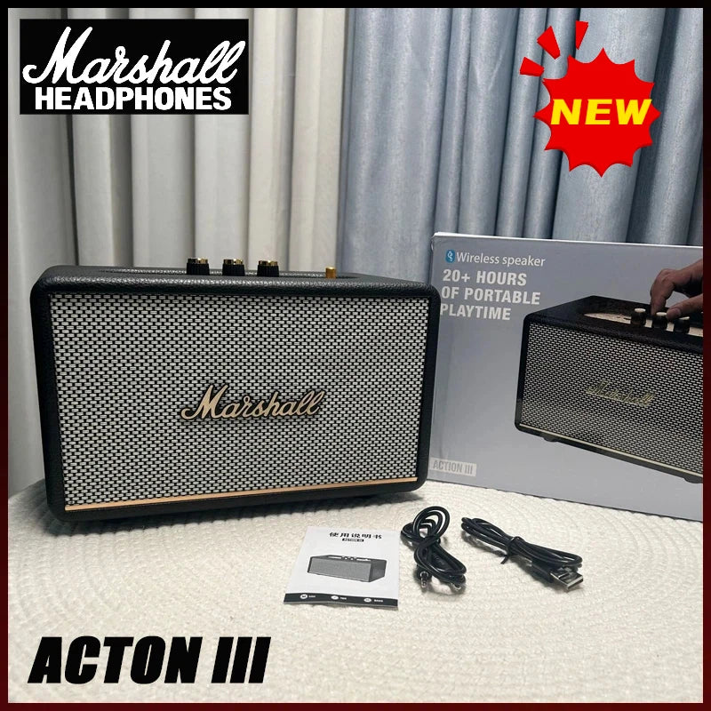 Marshall Acton III speaker with packaging, cable, and manual on a light surface.