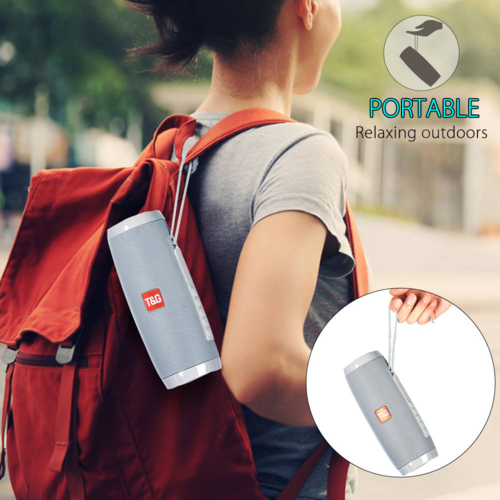 Person with a red backpack carrying a gray portable speaker, with 'T&G' branding.