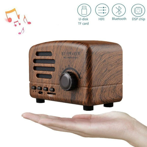 Wooden Bluetooth speaker on a white background with connectivity icons above it.