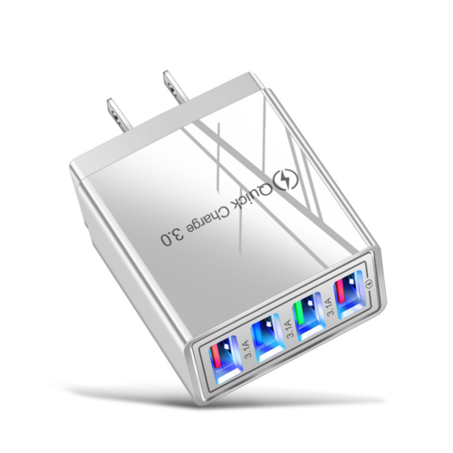 Silver four-port USB charger with LED indicators on a white background