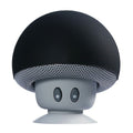 Black and gray mushroom-shaped speaker on a white background